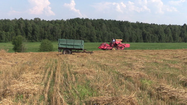 farm tractor work in village field.