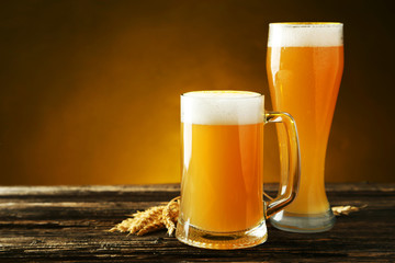 Glass of beer on a brown wooden background