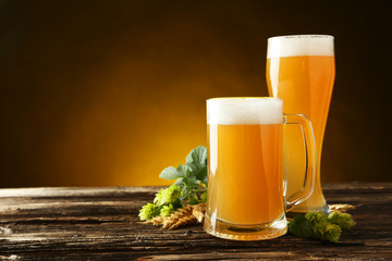 Glass of beer on a brown wooden background