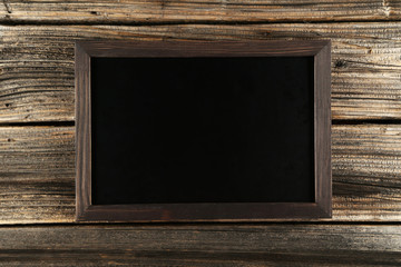 Wood frame on brown wooden background
