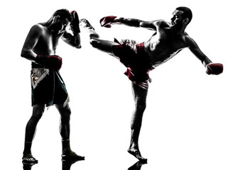 Fototapeta na wymiar two men exercising thai boxing silhouette