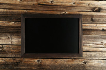 Wood frame on brown wooden background