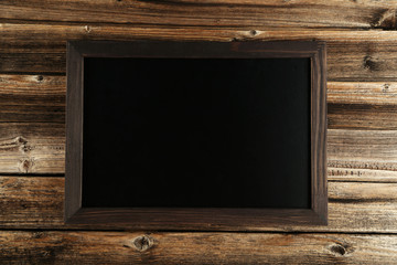 Wood frame on brown wooden background