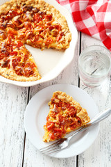 Fresh tomato pie on white wooden background