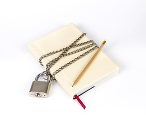 padlock protects the book in a concept on protect the secret inf