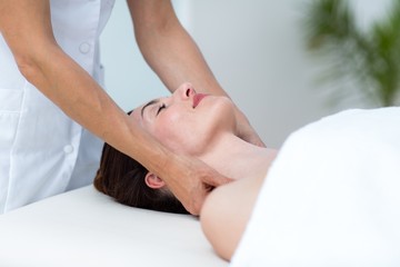 Fototapeta na wymiar Physiotherapist doing neck massage 