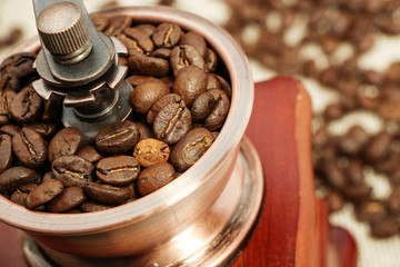 Closeup coffee bean and coffee grinder