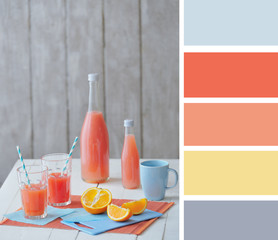 Still life with citrus fruit and juice and color palette