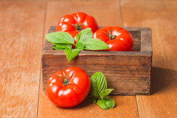 Tomatoes in wooden  box
