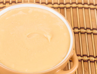 Pea soup in a green bowl.