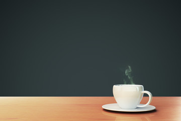 cup of coffee on a wooden table with copyspace