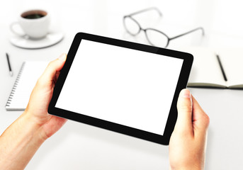 hands holding blank digital tablet