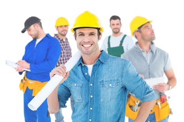 Composite image of confident architect holding rolled blueprint