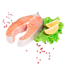 Raw salmon steak with lemon.