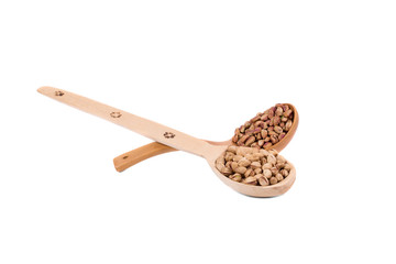 Wooden spoons with pistachios.
