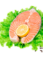 Fresh salmon steak on lettuce.