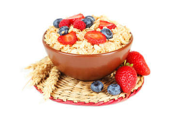 Oatmeal with berries isolated on white