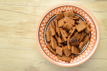 Rusks in a bowl on a wooden table
