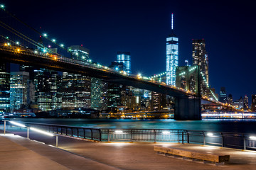 Brooklyn Bridge, Downtown Manhattan, New York. Night scene. Light trails. City lights. Urban living...