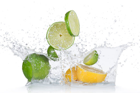 Limes and lemons with water splash