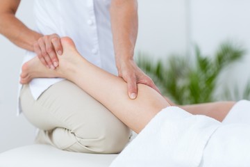 Fototapeta na wymiar Physiotherapist doing leg massage