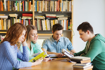 Fototapeta na wymiar students with books preparing to exam in library