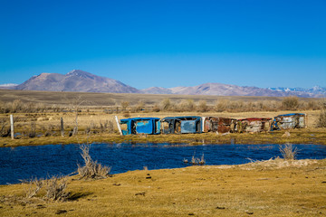 fence of broken old cars. Russia. Altai.