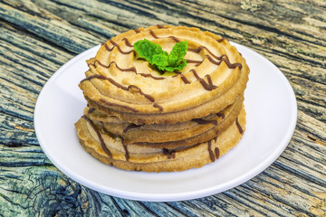 Cookies with chocolate lines on a plate 