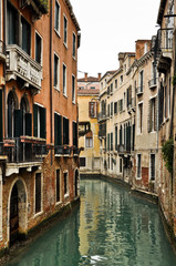 Fototapeta na wymiar Canal and Historic Houses in Venice, Italy