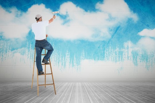 Composite Image Of Man On Ladder Painting With Roller