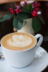 hot coffee latte, latte art with heart in a white cup