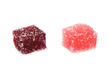 Two tasty red jelly cubes isolated on white. 