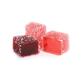 Tasty three red jelly cubes isolated on white.