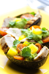 avocado filled with chicken salad and avocado dip