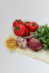 Vegetables for coocking pasta: garlic, onion, tomato, parley