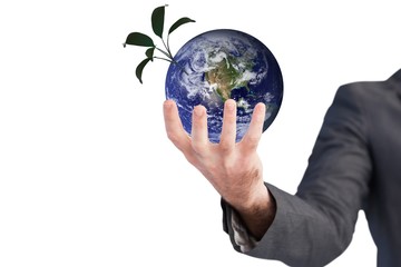 Composite image of businessman presenting with his hands