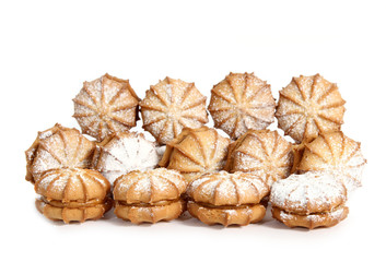 Sweet cookies with flour over it on white background. 