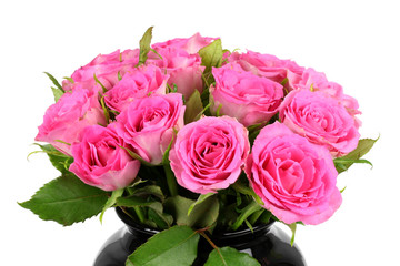 a bouquet of roses in a black vase.