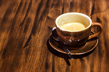Coffee cup on wood table.