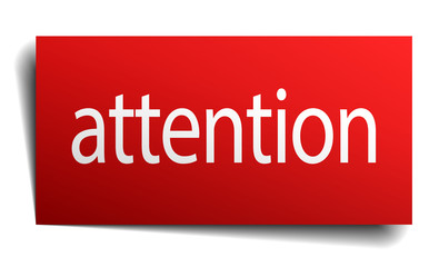 attention red paper sign isolated on white