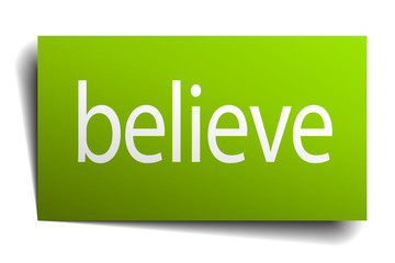 believe green paper sign on white background