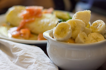 fruit with omelette  in the background