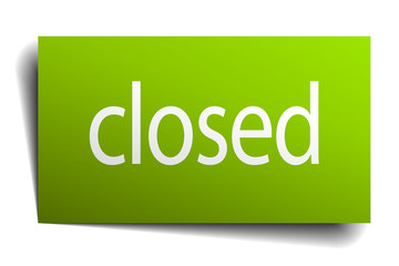 closed green paper sign on white background