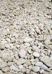Pile rounded stones on the beach