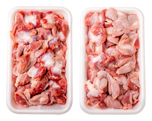 Raw frozen chicken gizzard in  plastic plate. Isolated on white