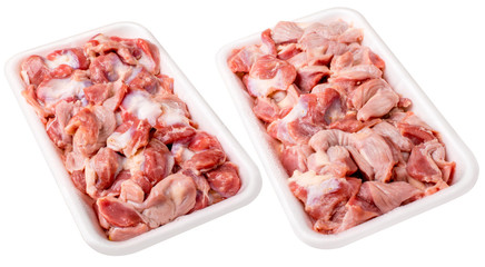 Raw frozen chicken gizzard in  plastic plate. Isolated on white