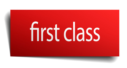 first class red paper sign on white background