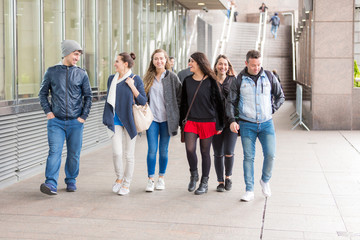 Fototapeta premium Group of friends walking and having fun together in London