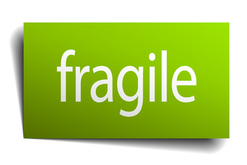 fragile green paper sign isolated on white