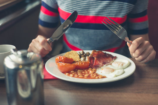 Woman having breakfast in diner